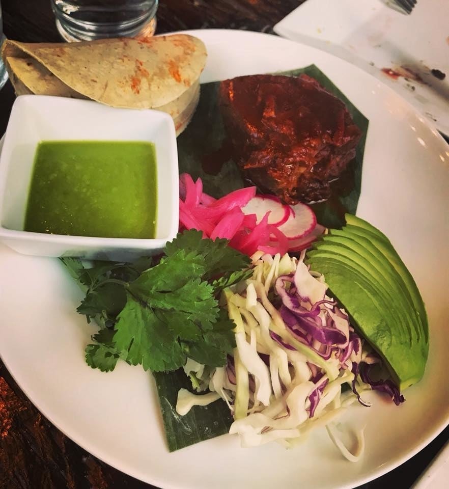 Tender, melt-in-your-mouth short rib is served with all the accoutrements you need to create Do-It-Yourself taco. The crunchy cabbage, pickled onions, radish, creamy avocado, and cilantro is paired with spicy tomatillo avocado salsa, all wrapped in warm tortilla.