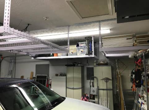 reviewer's pic of garage with overhead heavy duty shelving units