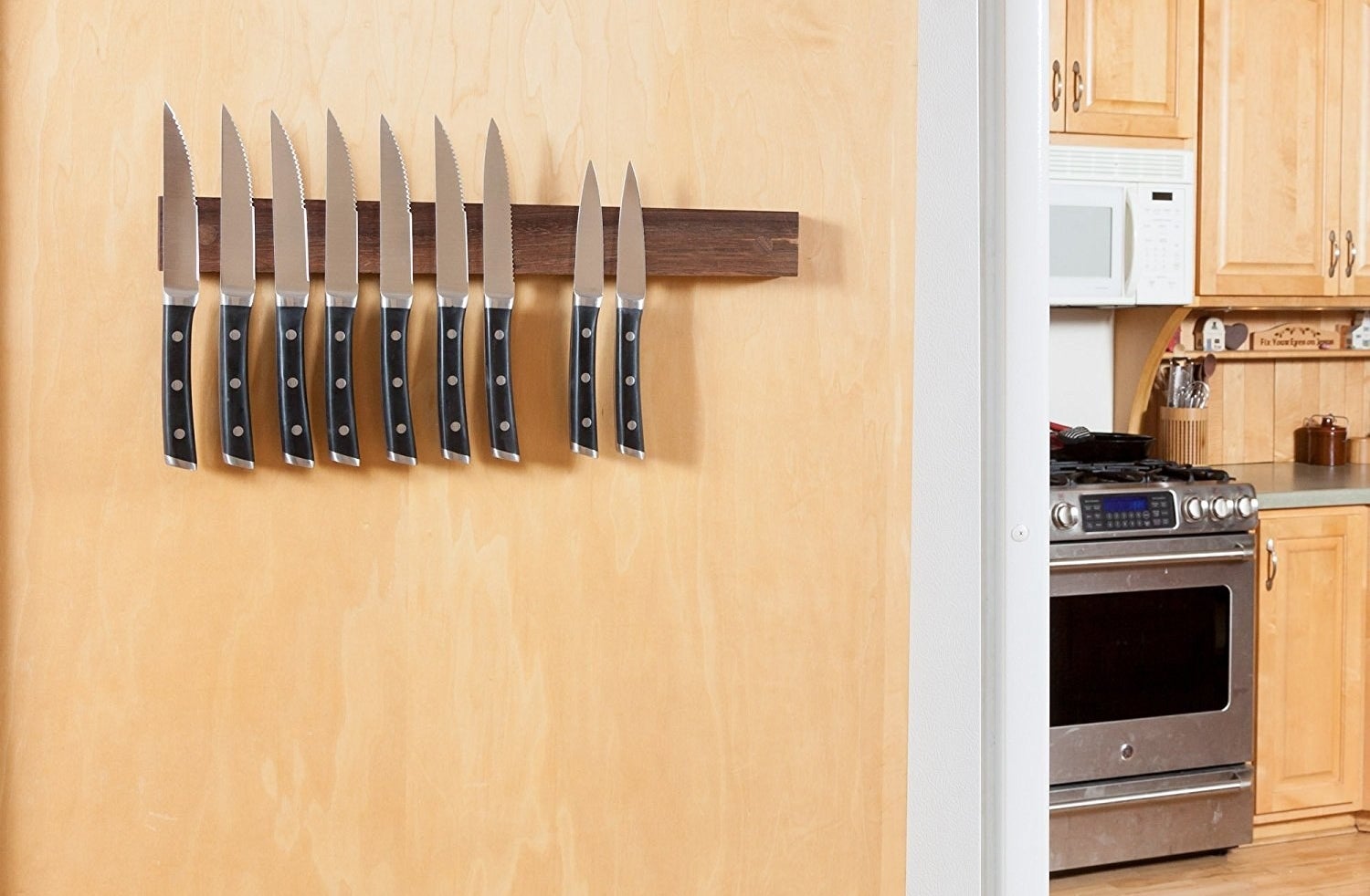 wood magnetic knife mount on a kitchen wall