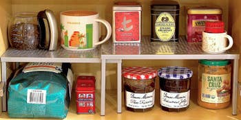 two tiny table-like shelves with 1 somewhat shorter truthful they tin interlock