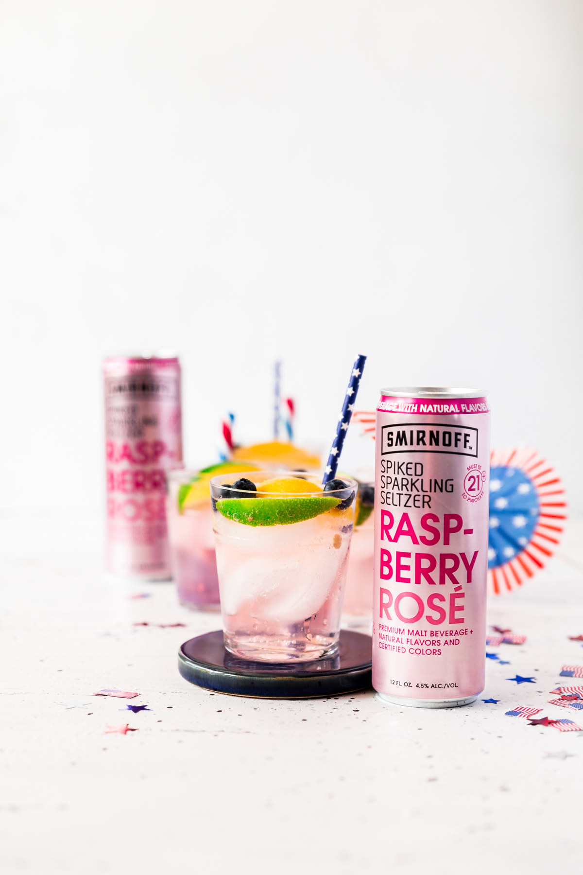 2 oz. coconut soda1 tbsp. fresh lime juice4 oz. Smirnoff Spiked Sparkling Seltzer Raspberry Rosé In a small glass filled with ice, combine the coconut soda, lime juice and Smirnoff Spiked Sparkling Seltzer Raspberry Rosé. Stir gently to combine. Garnish with blueberries, lemons, limes, festive straws and enjoy!