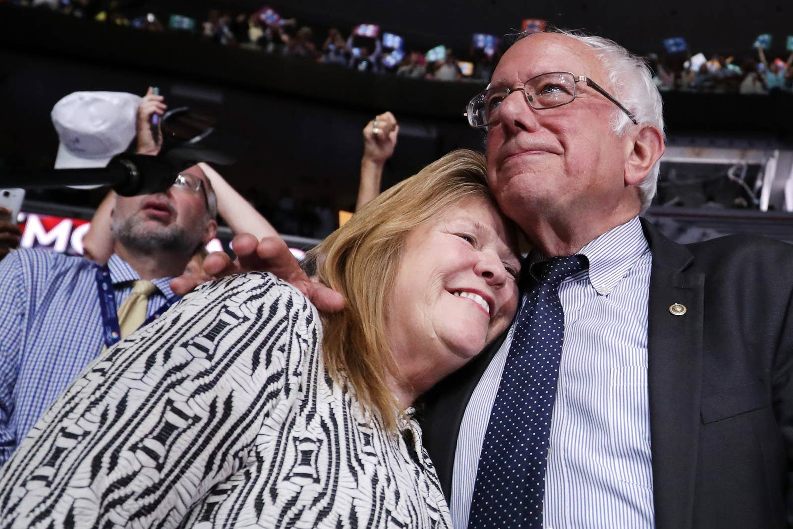 Senn Bernie Sanders embraces his wife, Jane O&#x27;Meara Sanders, after the Vermont delegation cast their votes during roll call on the second day of the Democratic National Convention on July 26, 2016, in Philadelphia.