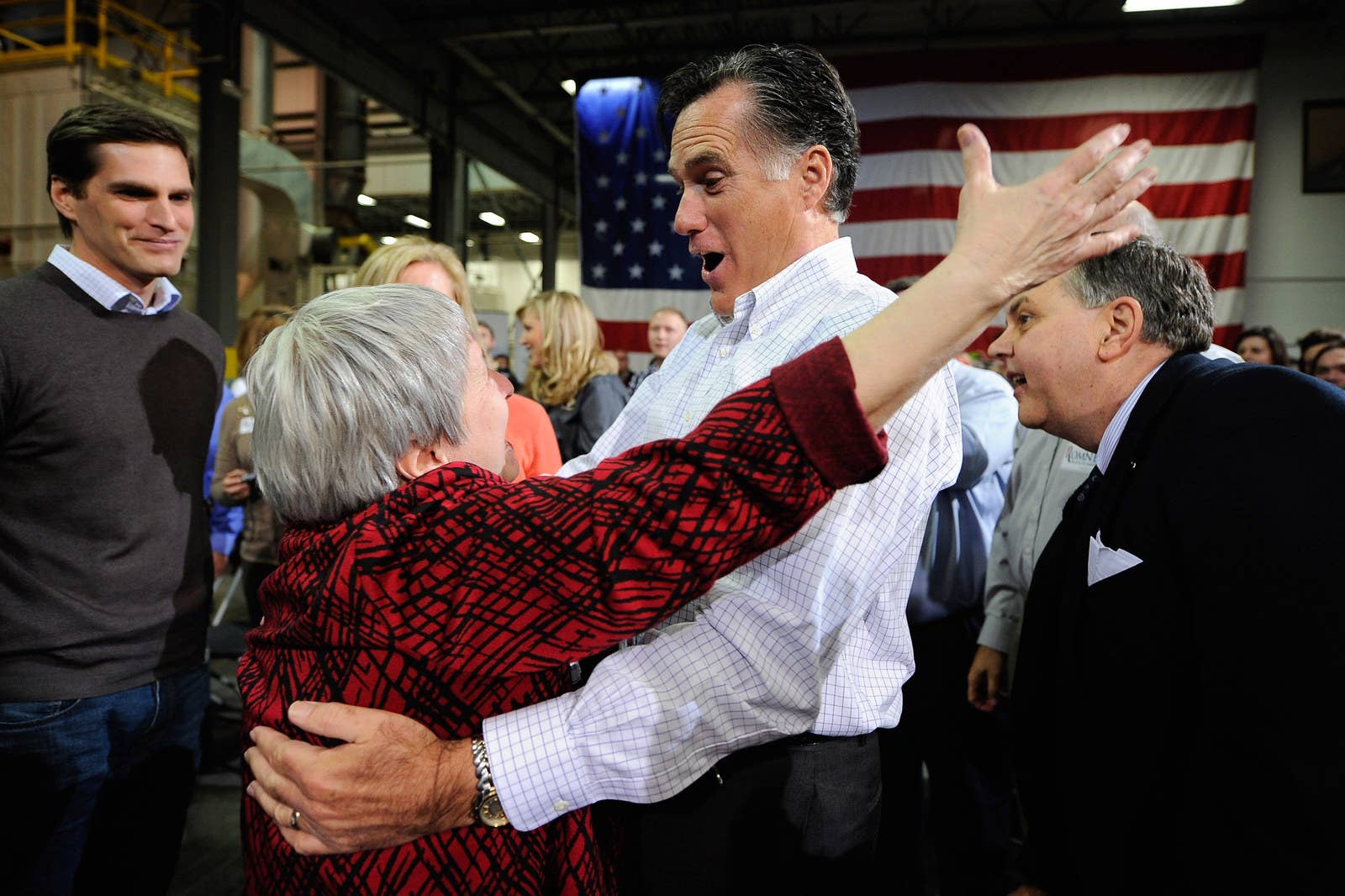 Republican presidential hopeful Mitt Romney hugs a supporter from Marion, Iowa, during a town hall meeting in Cedar Rapids on Dec. 9, 2011.
