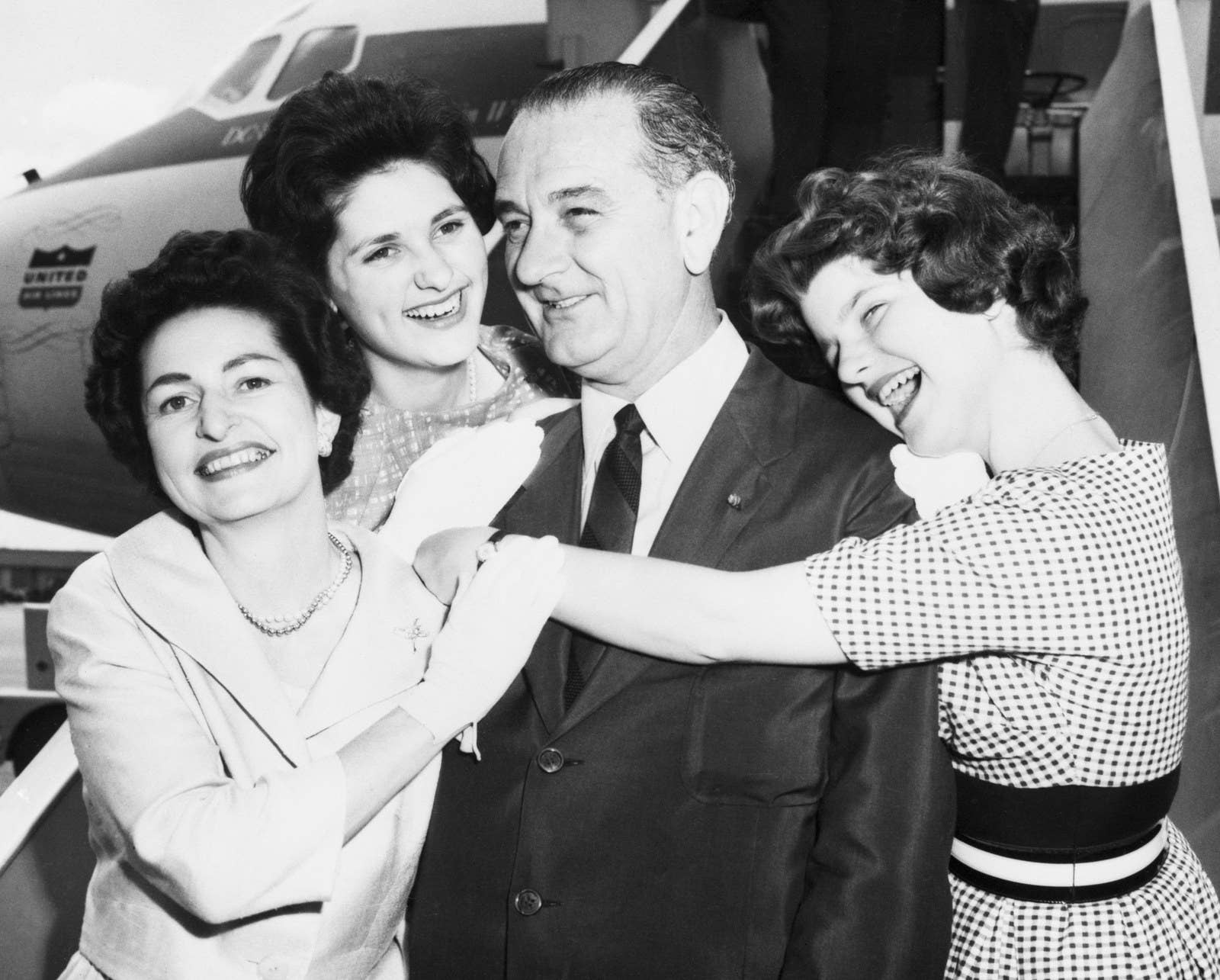 Luci and Linda Johnson hug their father, Vice President Lyndon B. Johnson, and their mother, Lady Bird Johnson, on Nov. 22, 1963.