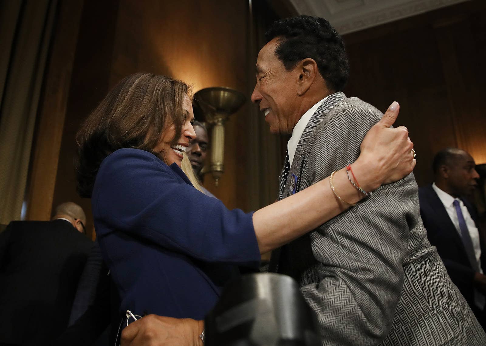 Singer and songwriter Smokey Robinson embraces Sen. Kamala Harris prior to a hearing of the Senate Judiciary Committee on May 15, 2018, in Washington, DC.