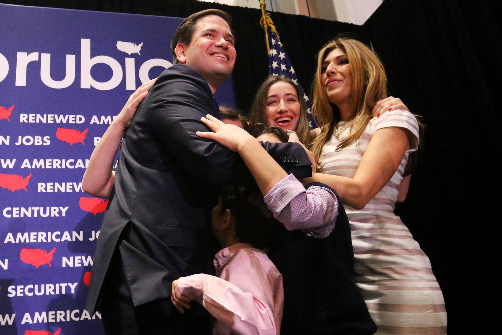 Republican presidential candidate Marco Rubio gets a hug from his family following a primary night rally on March 15, 2016, in Miami.