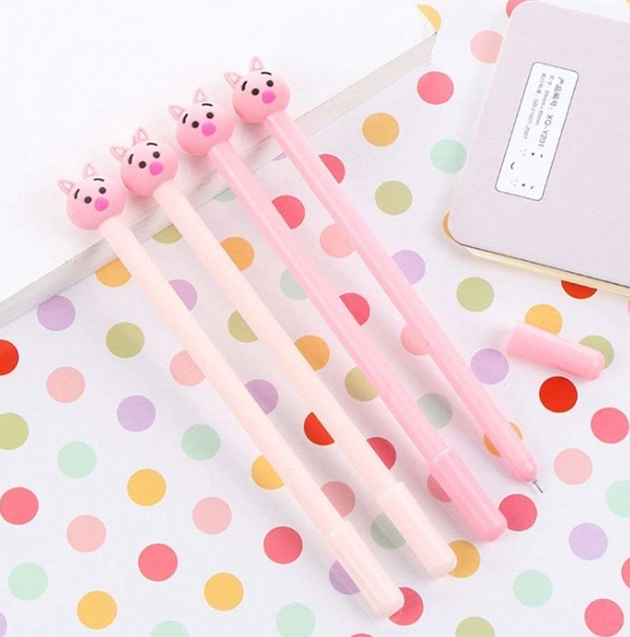Four of the pens with pig faces on the tops