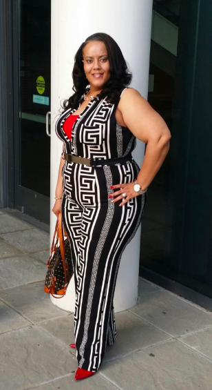 reviewer in black and white graphic print sleeveless jumpsuit with black belt