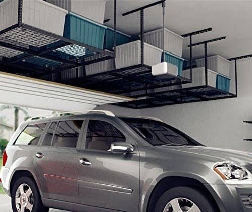The storage racks hanging from the ceiling of a garage