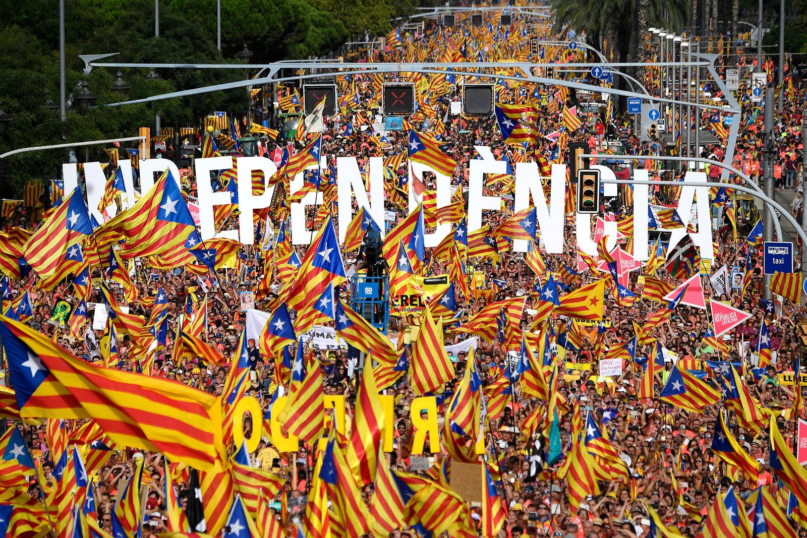 People wave pro-independence Catalan flags during a demonstration in Barcelona on Sept. 11.