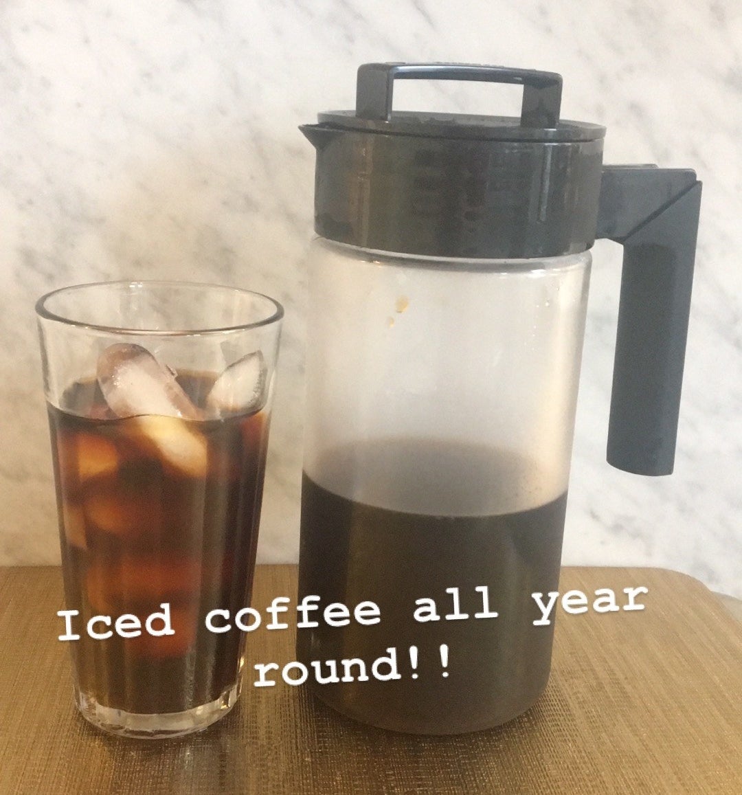 BuzzFeed Editor Maitland Quitmeyer shows her Takeya cold brew maker next to a glass of iced coffee in her kitchen