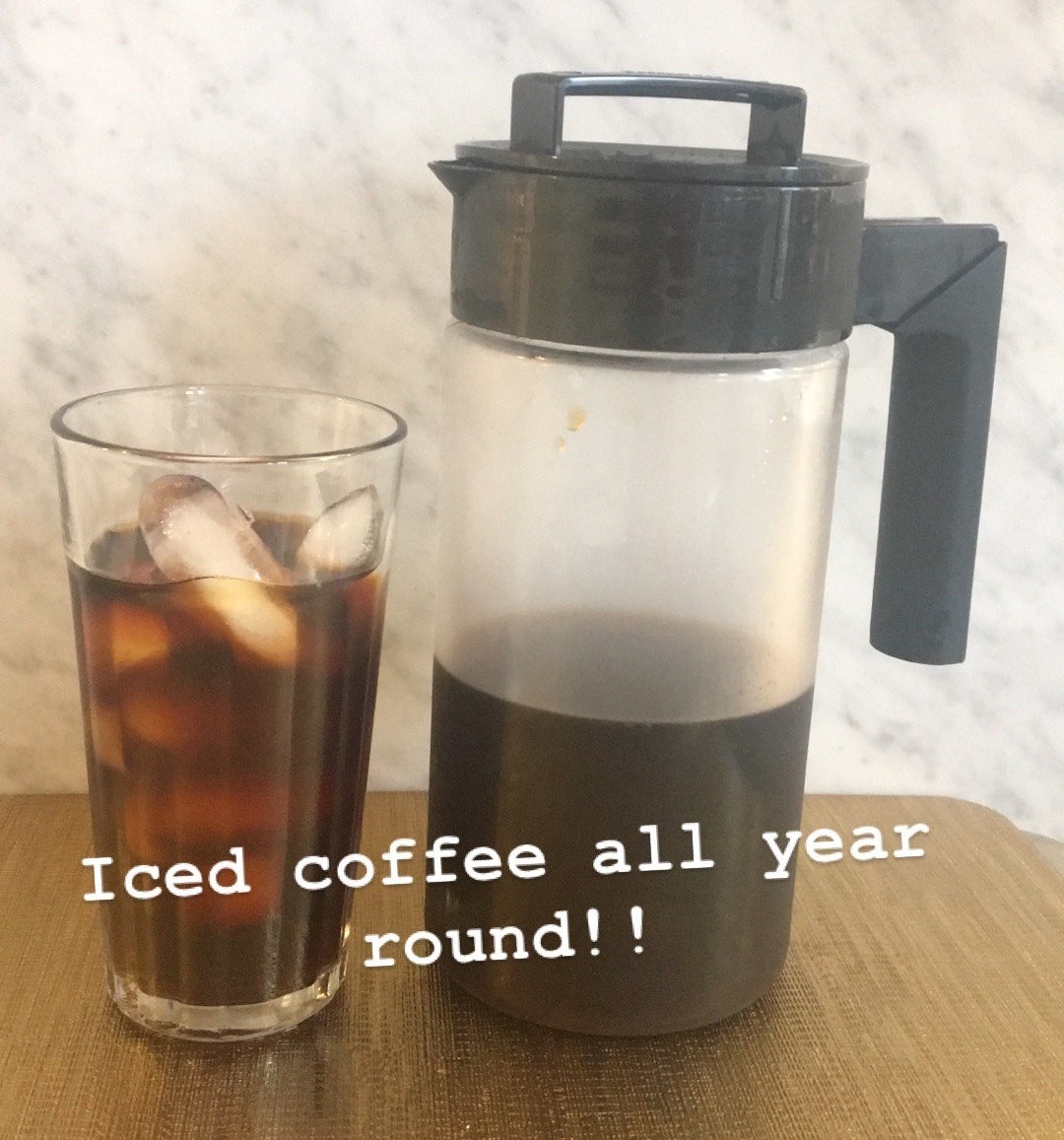 BuzzFeed Editor Maitland Quitmeyer shows her Takeya cold brew maker next to a glass of iced coffee in her kitchen