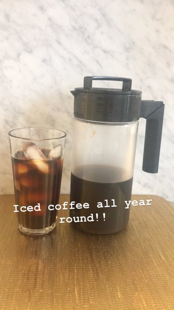 BuzzFeed editor Maitland Quitmeyer shows her Takeya cold brew maker next to a glass of iced coffee in her kitchen