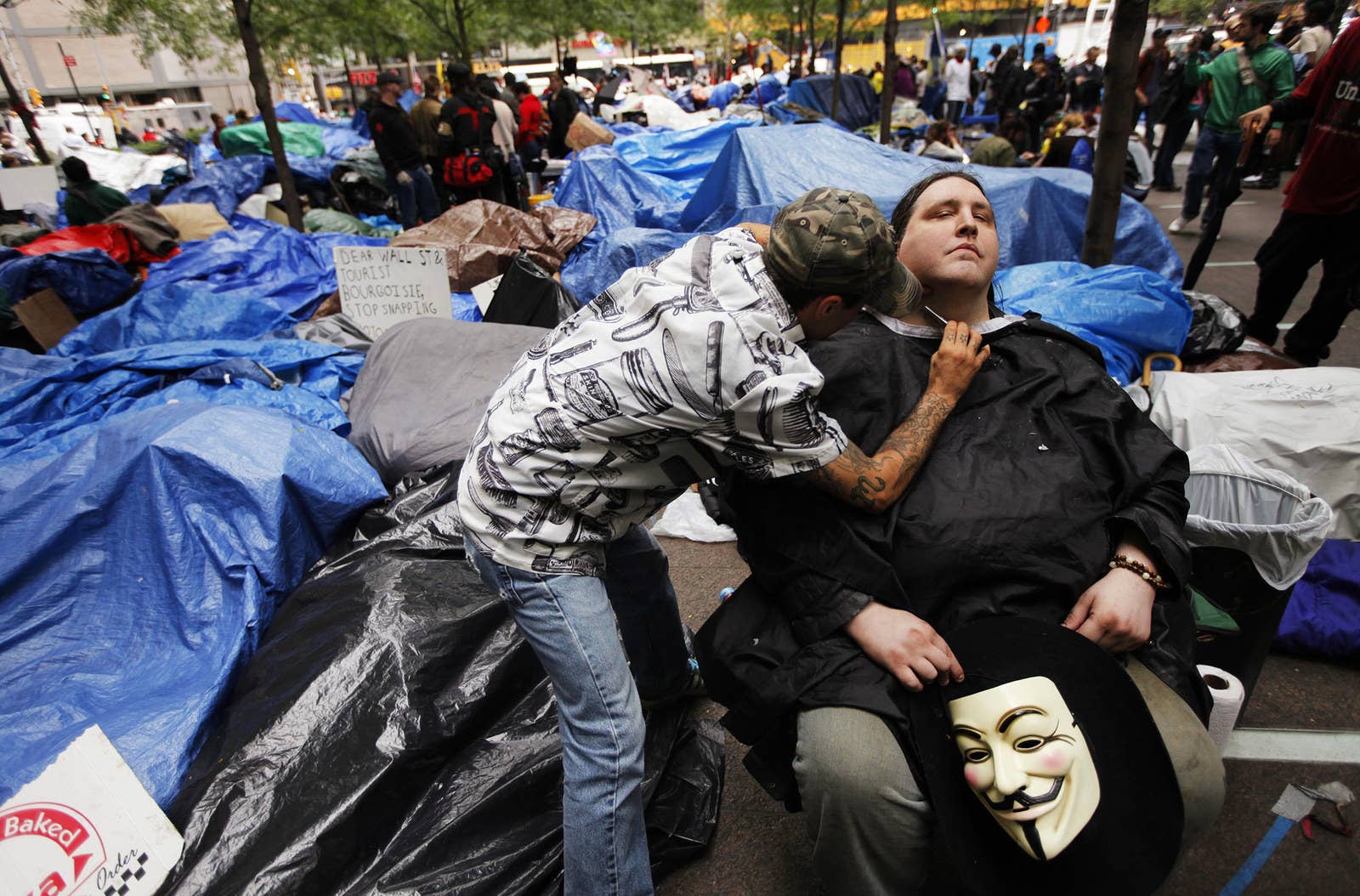 A member of the Occupy Wall Street movement gets a shave in Zuccotti Park on Oct. 12, 2011.