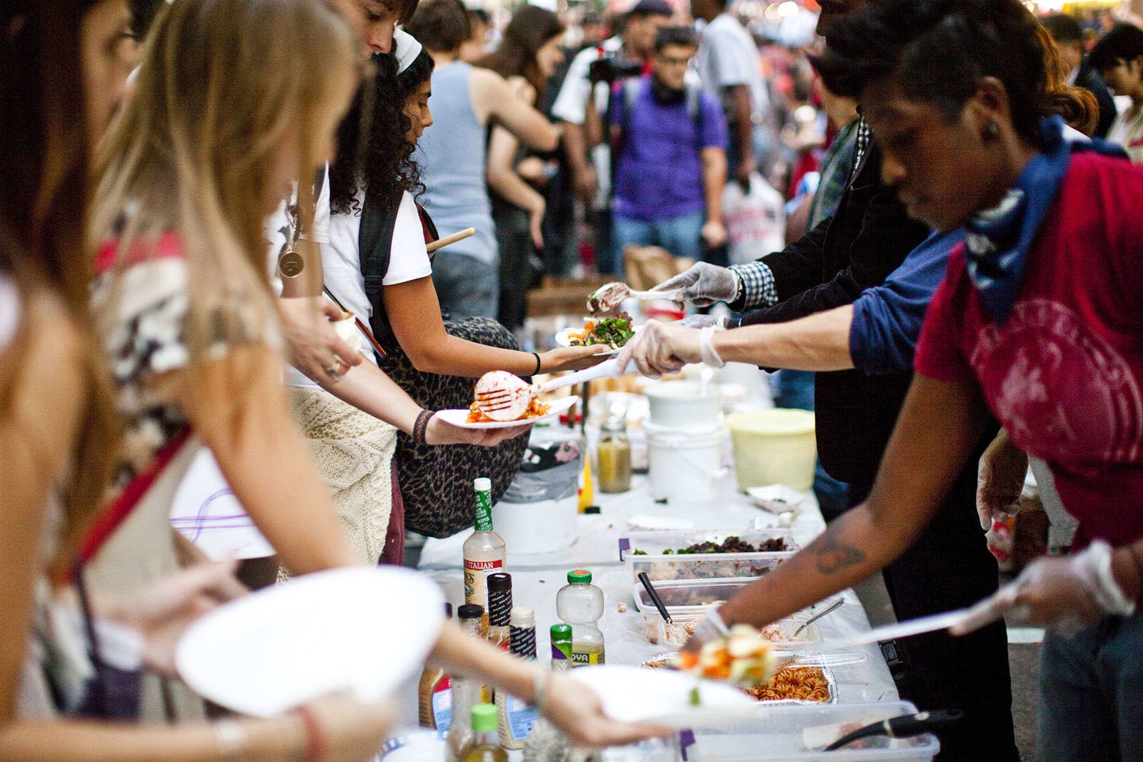 Volunteers serve food to protesters at Zuccotti Park on Oct. 8, 2011.