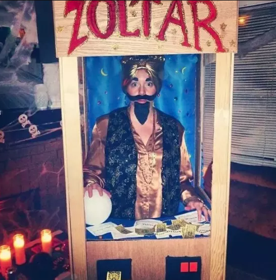 Someone dressed as the fortune teller box and Zoltar