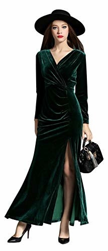 Model wearing the emerald green velvet maxi dress with a side slit