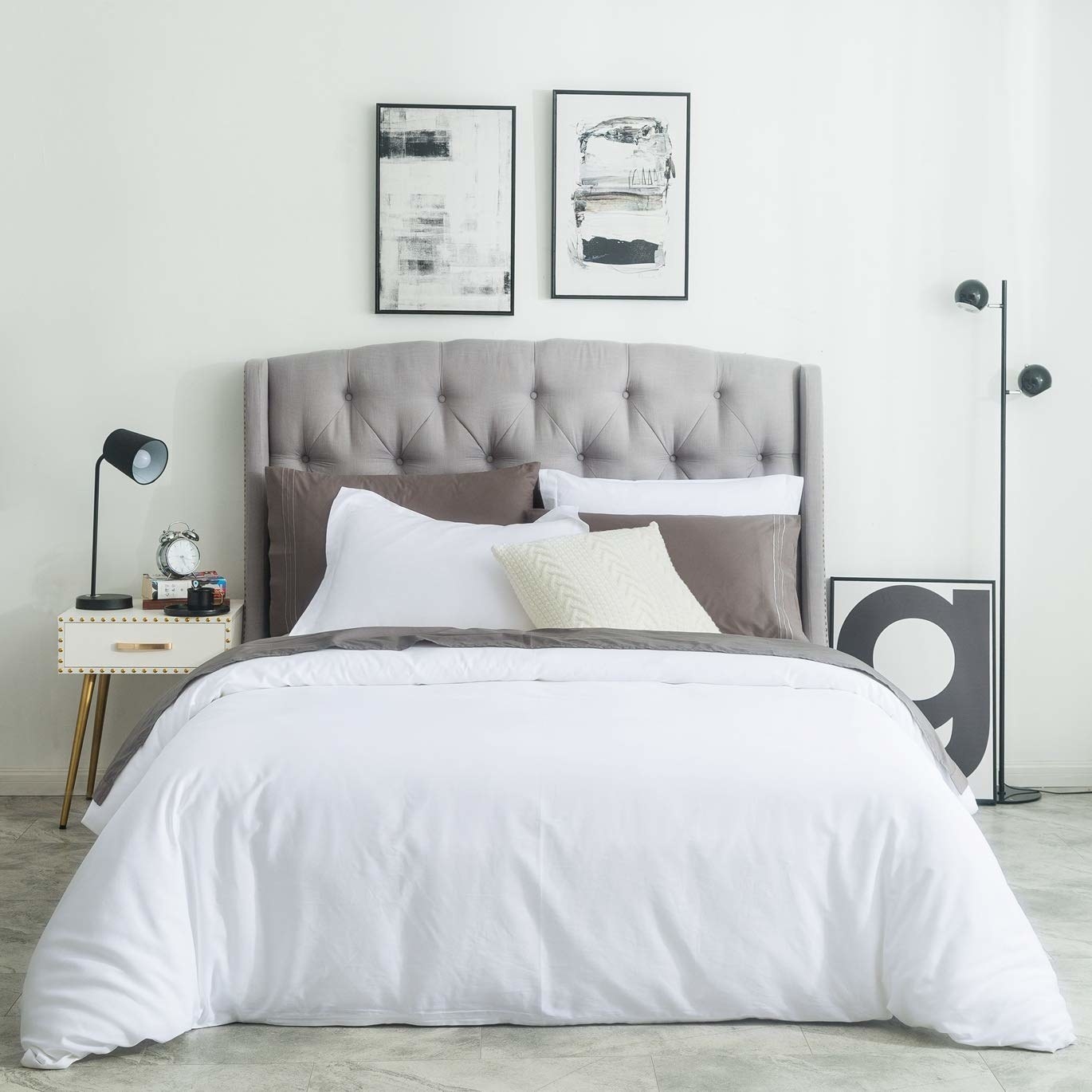 the white duvet set with grey pillows