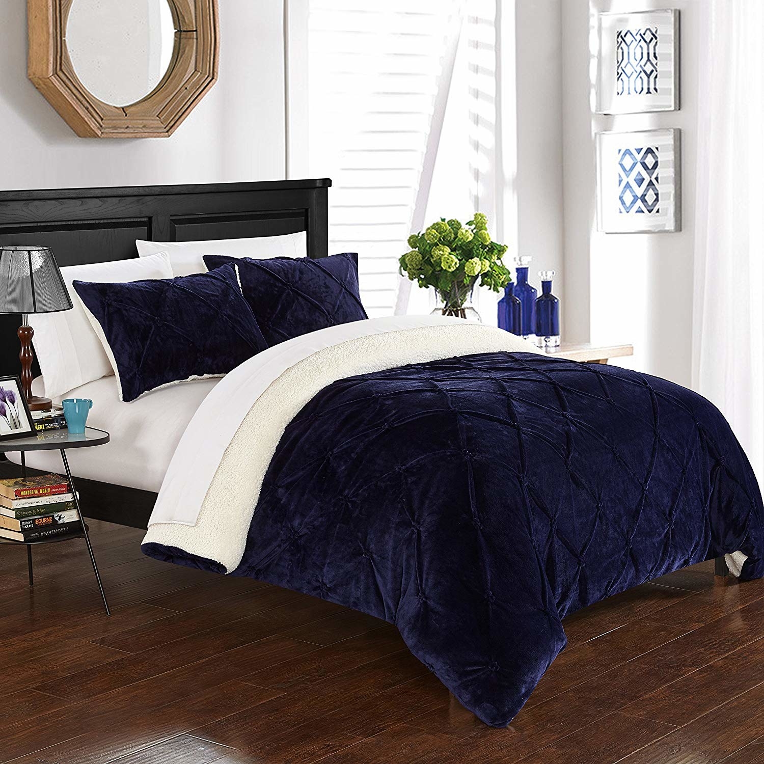the dark blue pleated duvet set with white sheets and white pillows