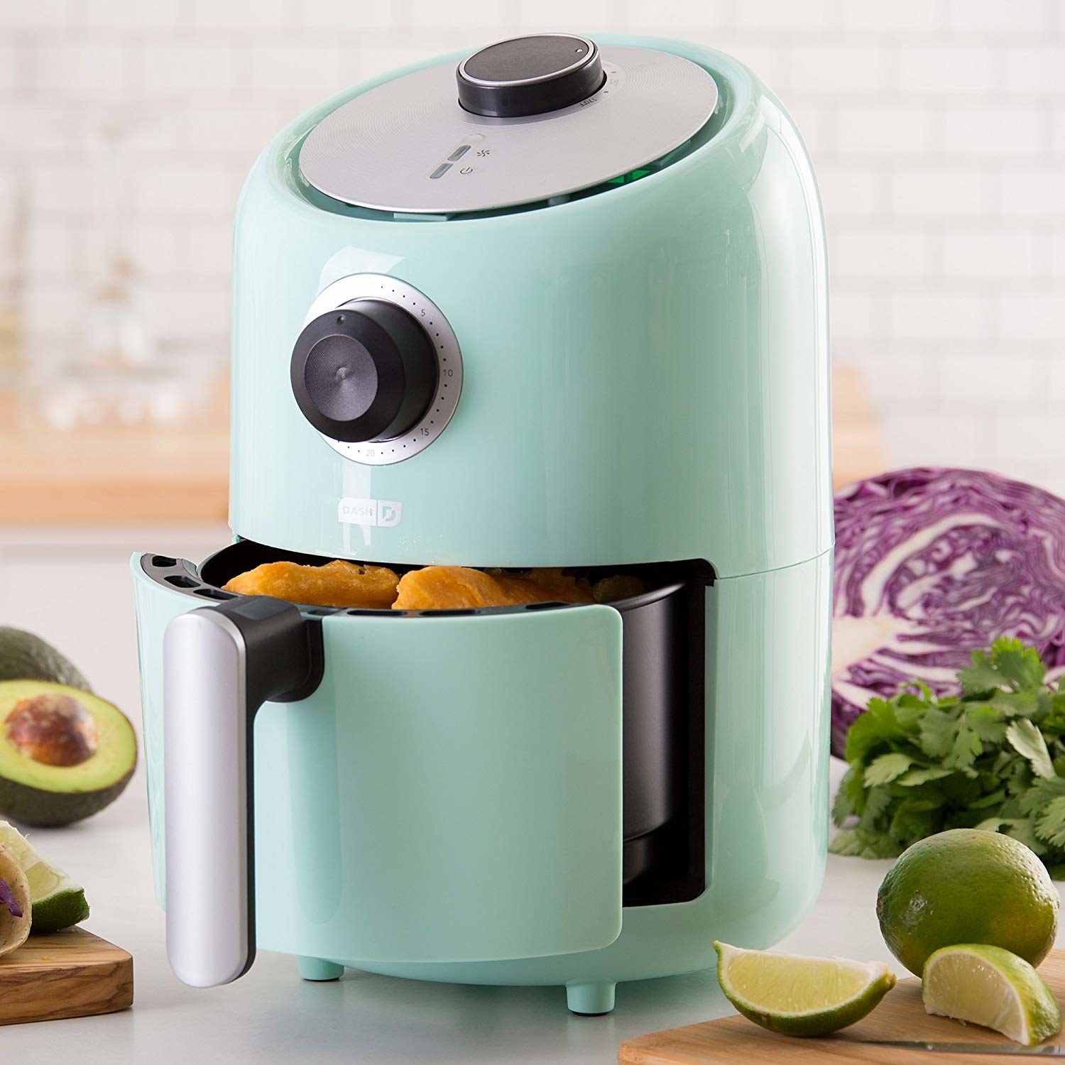 the cylindrical air fryer in light blue, with a knob dial and a front pull-out baket