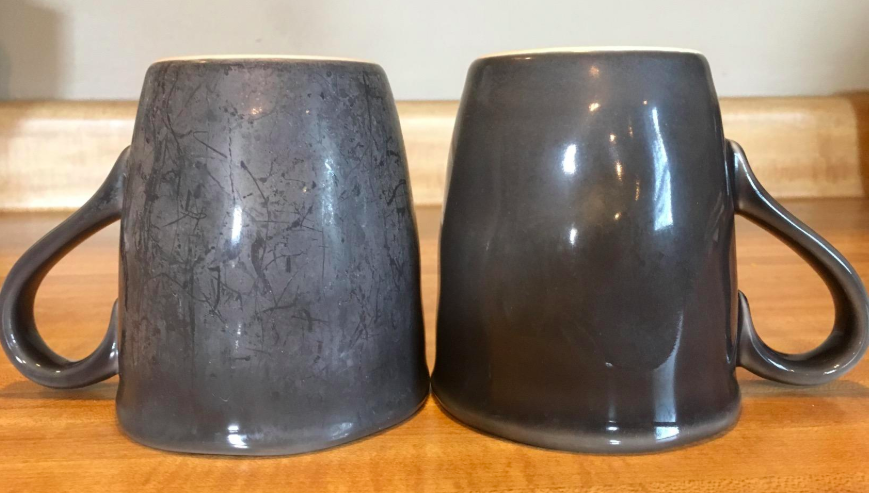 reviewer photo of stained mug next to a clean mug after using powder