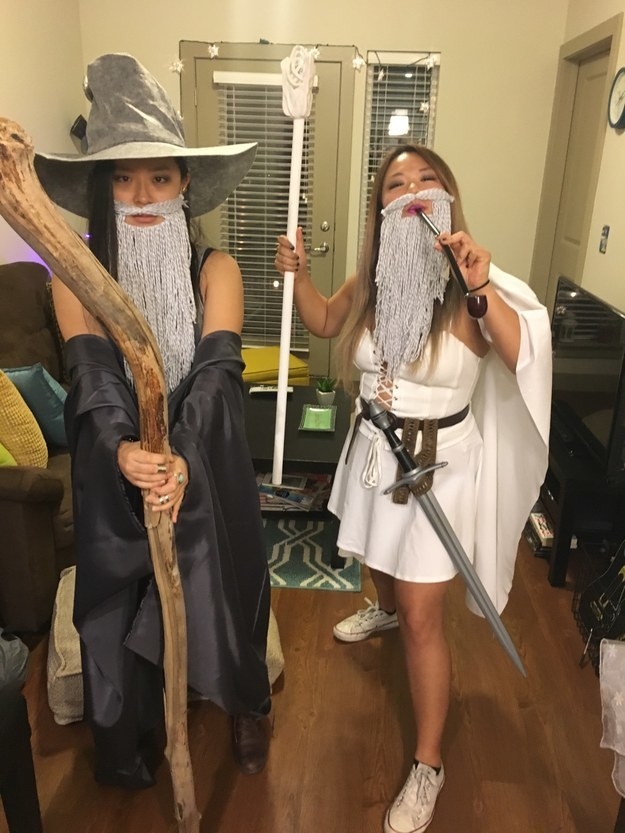 Two people dressed as Gandalf, one in gray and one in white
