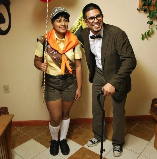 Two people dressed as a Boy Scout and an old man