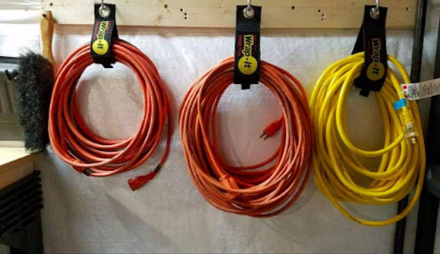 three large extension cords looped with the strips