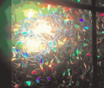 A customer review gif of light shining through the film causing rainbow patterns