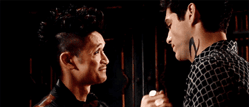 Characters Alec Lightwood and Magnus Bane kissing