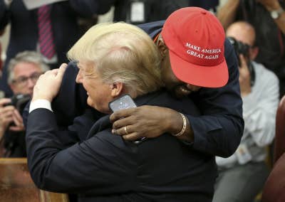Trump hugs Kanye West.