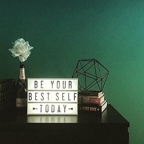 An alphabet lightbox with the words &quot;Be Your Best Self Today&quot; on a table 