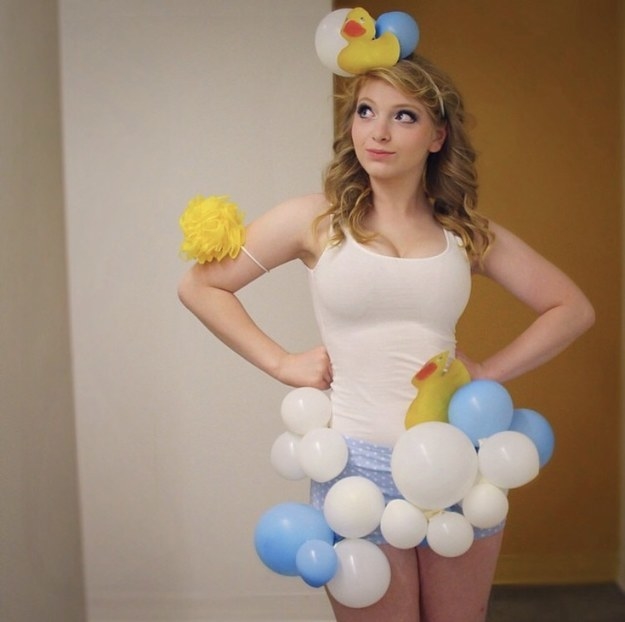 girl with balloons and a rubber duck on her head