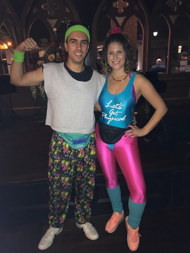 girl in a leotard with man in brightly colored pants