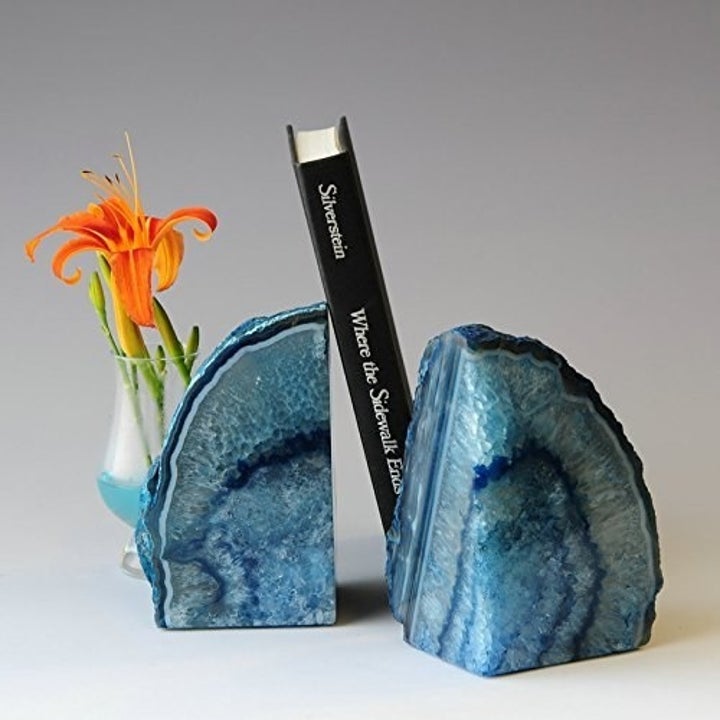 Blue agate bookend holding book 