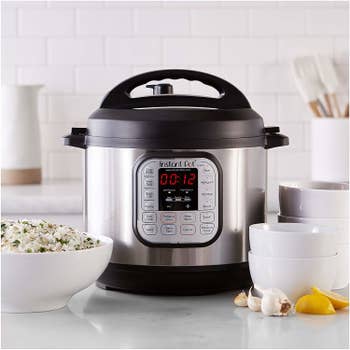Front shot of the Instant Pot, featuring a digital display and various cooking presets