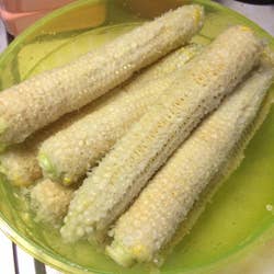 a pile of stripped ears of corn 