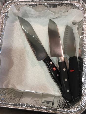 reviewer's knives in an aluminum container before getting the organizer