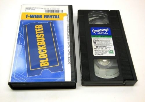 A Blockbuster VHS case with a VHS tape next to it