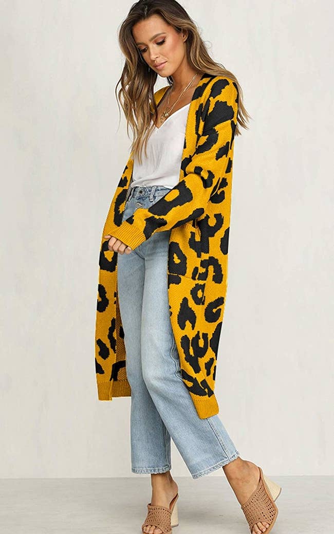 model wears cardigan with oversized leopard print 