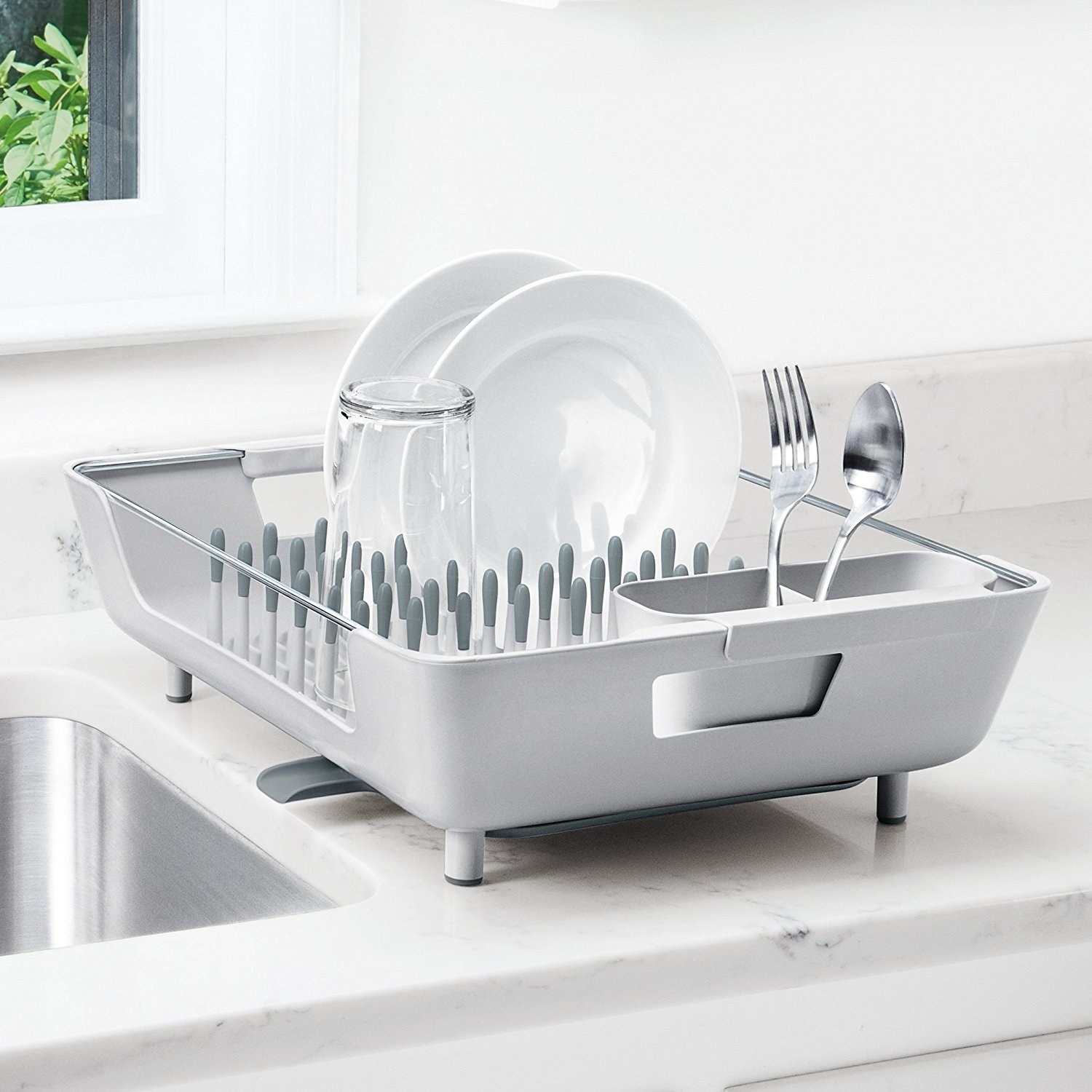 Promising review: "I love how the water filters into a small drop-off point!!! My counter has started to become damaged due to the water overwhelming the mat I had underneath it. Had a friend who had it and used it at their house and fell in love. Hate the price but I bought used and it was basically new! It had the original plastic and cardboard in it. Expensive but WORTH IT IF YOU WASH by hand. LOVE THIS." —Jess K Burts Get it from Amazon for $39.95.