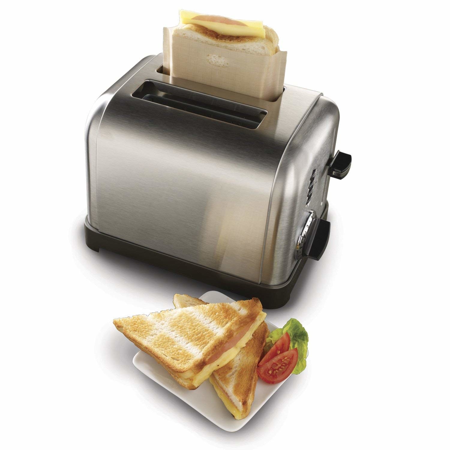 A grilled cheese sandwich, and a toaster with another grilled cheese in the bag