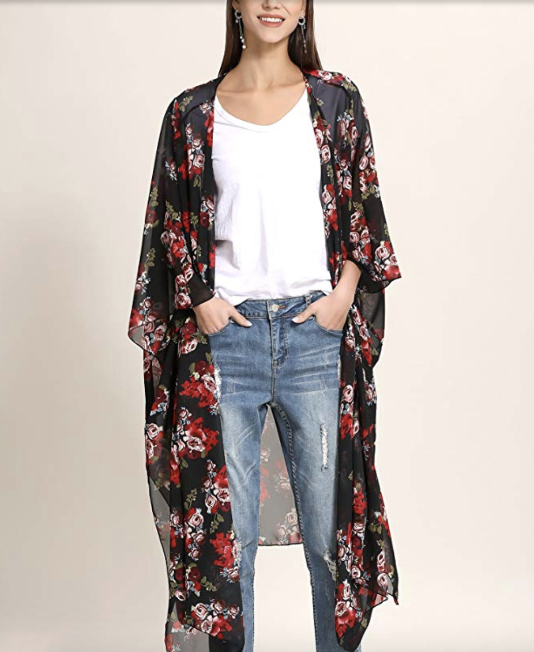 model wearing the long top in black with red and white floral pattern