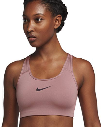model wearing sports bra with Nike swoosh