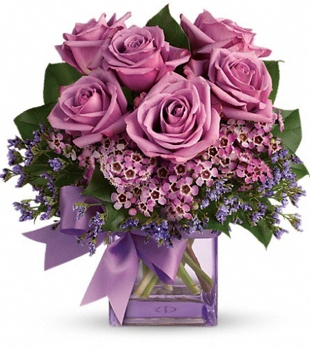 bouquet of purple roses with a purple bow