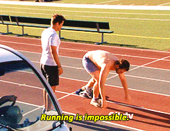 a gif of chris prat laying on a track