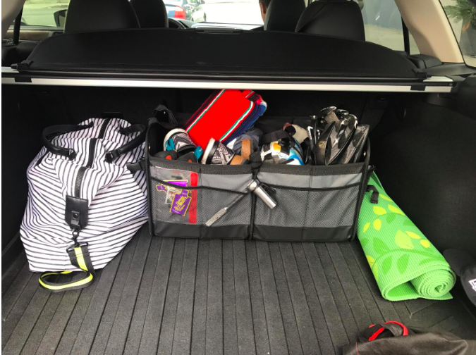 a reviewer&#x27;s photo of the trunk organizer 