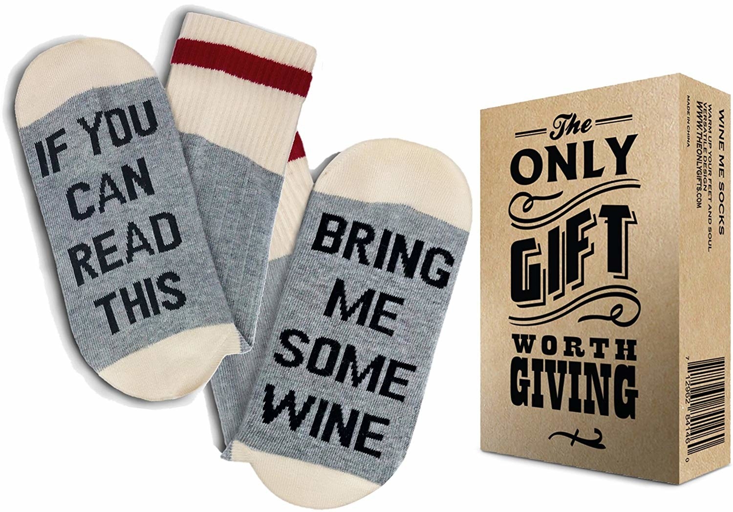 A pair of grey socks where one says &quot;If You Can Read This&quot; on the sole and the other has &quot;Bring Me Some Wine&quot; on it with the box next to it