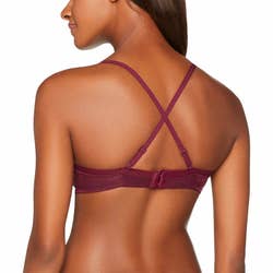 Model wearing red bra's criss-cross back straps