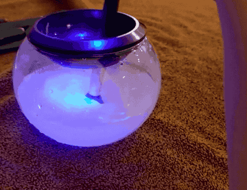 gif of light up orb with water and a spinning brush inside 